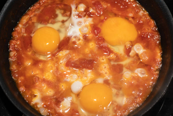 Fiery Eggs in Purgatory: Spicy Tomato-Poached Eggs for Breakfast Bliss
