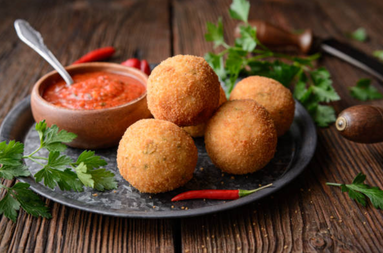 Arancini: Crispy Sicilian Rice Balls with a Melty Surprise Inside