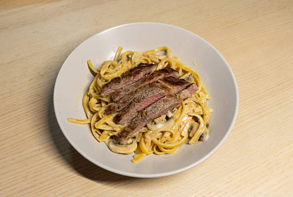 Decadent Pasta with Gorgonzola Sauce and Sliced Beef Tenderloin